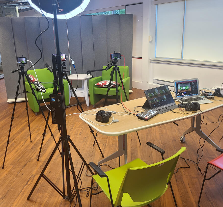 The actual StudioAnywhere multi-camera video rig — four phones on tripods, ring light, ATEM switcher and PodTrak P4 on the table